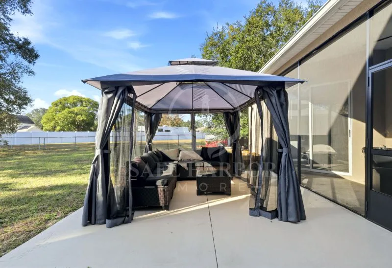Assisted living amenities florida outdoor patio at Safe Harbor Amoré assisted living home in Spring Hill, Florida