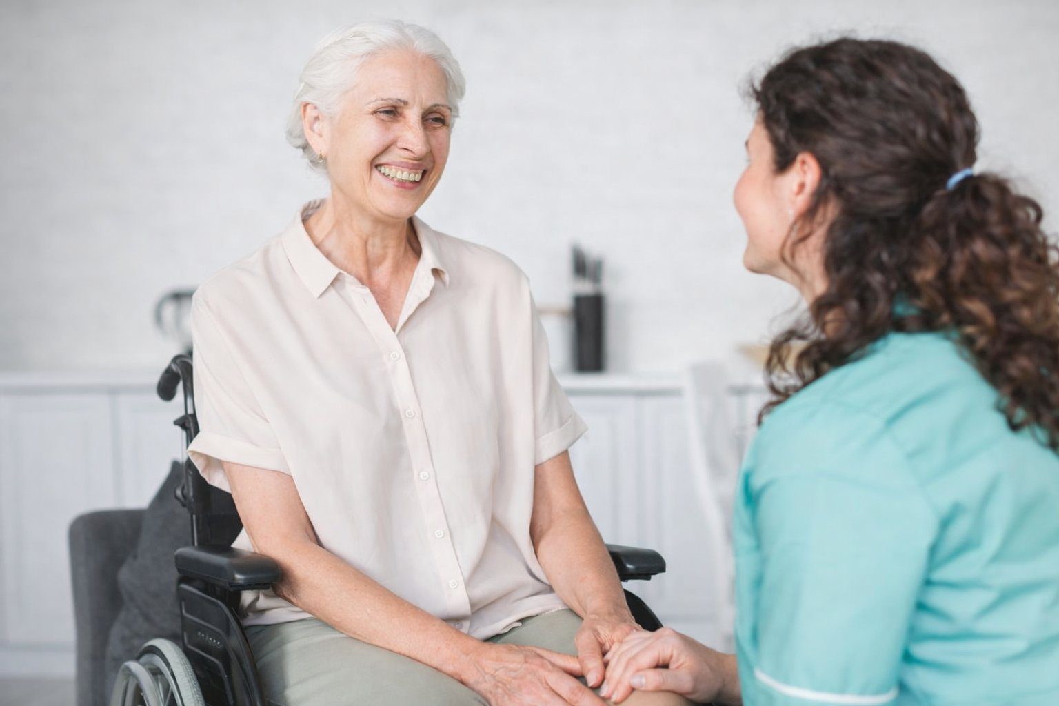 Senior receiving compassionate care from a professional caregiver at Safe Harbor Amoré assisted living in Spring Hill, Florida